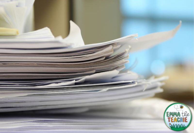 A stack of poorly organized papers on a desk.