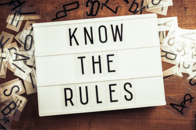 An image of a letter board that reads, “KNOW THE RULES.”