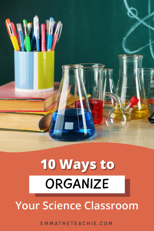 Pin image with a photograph of a desk with glassware, books, and a pen pot, and writing on the bottom that reads, "10 Ways to Organize Your Science Classroom."